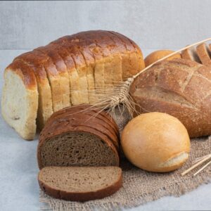 Various homemade bread on burlap with wheat. High quality photo