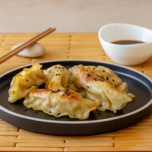 Momos - Fried Veg (10 pcs) ꭞ